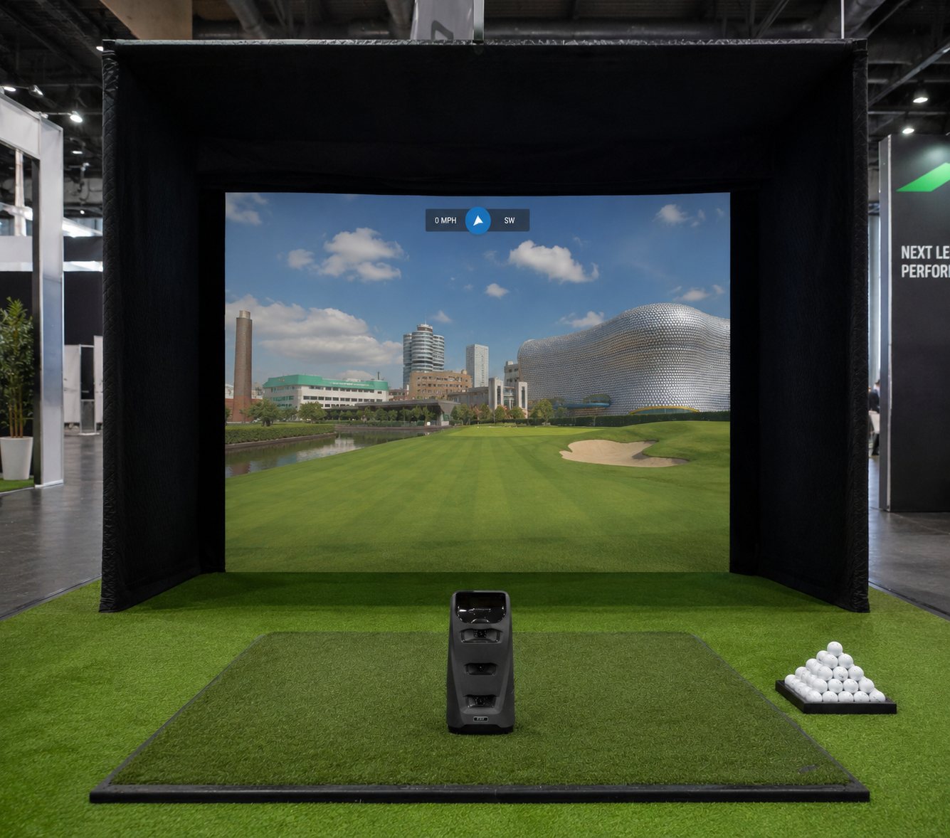 Teed Up golf simulator on an exhibition stand, playing a golf hole beside the Bullring Selfridges building on the impact screen