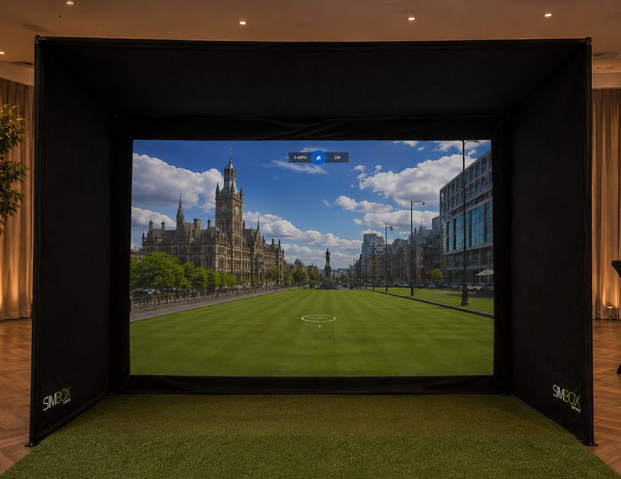 Teed Up golf simulator in a Manchester venue, playing a golf hole in front of Manchester Town Hall on the impact screen